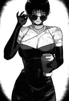 a woman in black and white holding a coffee cup