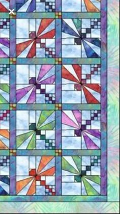 a colorful stained glass window with many different colors