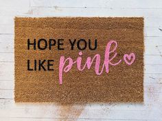 a door mat that says, hope you like pink