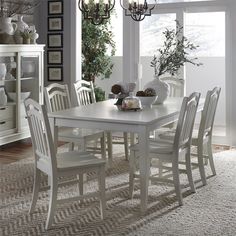 a white table and chairs in a room