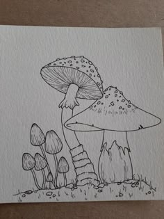 a drawing of mushrooms in the grass