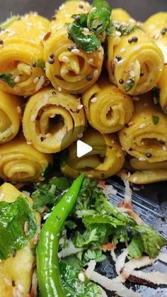 some food that is on top of a plate with broccoli and other vegetables