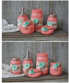 four mason jars with flowers on them are sitting on a wooden table next to a lace doily