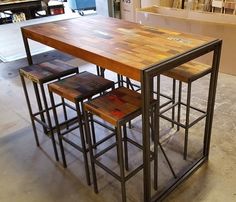 a kitchen table made out of wood and metal