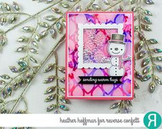 a close up of a card with a snowman on it and some glitters