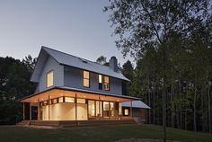 a modern house in the woods at night