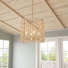 a chandelier hanging from the ceiling in a room