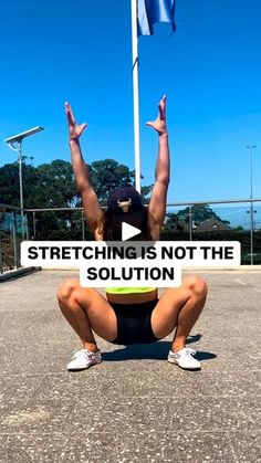 a woman squatting on her knees with the words stretching is not the solution in front of her