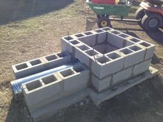 some concrete blocks are stacked on top of each other and ready to be placed in the ground