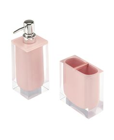 two pink soap dispensers sitting next to each other