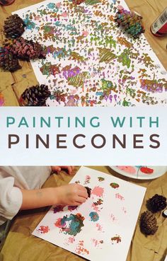 a child is painting with pinecones on the table next to some paintbrushes