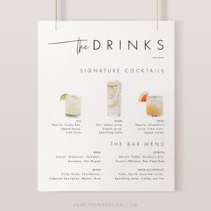 the drinks menu is hanging on a white wall and has four different types of beverages