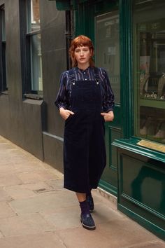 A soft cord pinafore dress. In a midi length that makes it perfect for in-between weather. Pair with plimsolls and a flouncy shirt underneath. Machine washable. 99% Cotton, 1% Elastane. Styling Pinafore Dress, Cord Dress Outfit, Wardrobe Reset, Midi Pinafore Dress, Cord Pinafore Dress, Pinny Dress, Clothing Guide, Dungaree Dress, Dressing Gown Robe