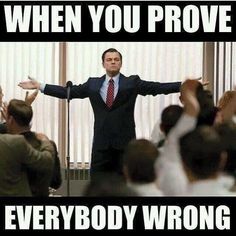 a man standing in front of a group of people with his arms out and the caption says, when you prove everybody wrong