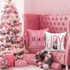 a pink christmas tree sitting next to a couch