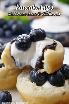 A pancake cup topped with blueberries being held up with a bite taken out of it. Recipe With Cream Cheese, Breakfast Sweets, Delicious Appetizer Recipes, Tasty Pancakes, Cream Cheese Recipes, Delicious Breakfast Recipes, Breakfast Treats