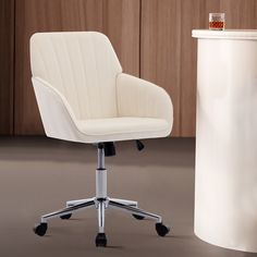 a white office chair next to a trash can