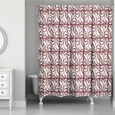 a white and red shower curtain in a bathroom