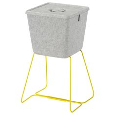 a grey and yellow planter on a stand