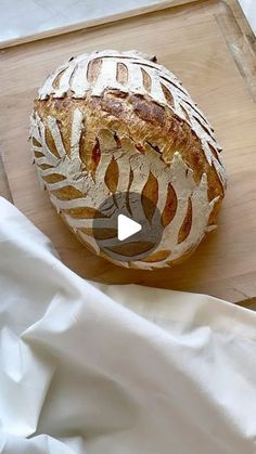 a loaf of bread sitting on top of a cutting board