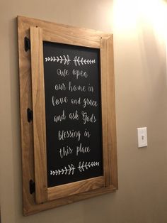 a framed chalkboard hanging on the wall in a bathroom