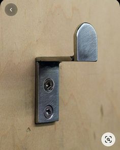 a door handle with two knobs on it