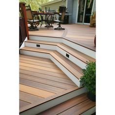 a wooden deck with steps leading up to it