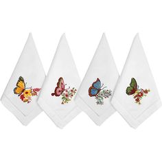 four white kitchen towels with colorful butterflies on them