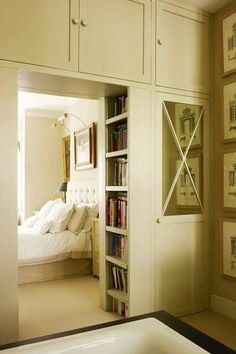 a bath tub sitting next to a book shelf filled with books