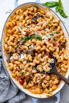 a skillet filled with pasta and sauce