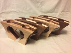 four pieces of wood sitting on top of each other