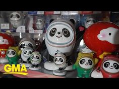 there are many panda figurines on the shelf