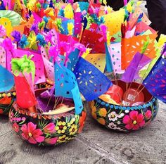 colorfully decorated baskets are sitting on the ground