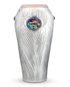 a white vase with a blue and pink design on the front, sitting against a white background