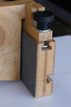 a wooden object with a camera attached to it