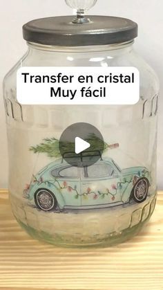 a glass jar with a car painted on it