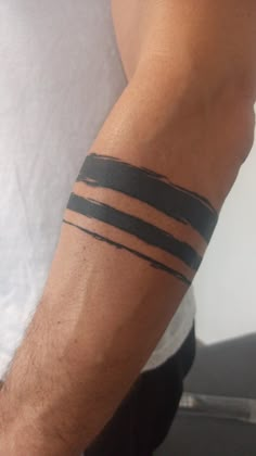 a man with a tattoo on his arm