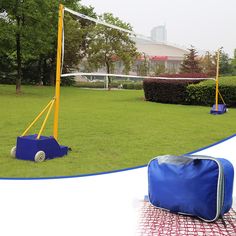 a blue bag sitting on top of a field next to a volleyball net