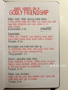 a bible verse on a godly friend is written in red and black ink over a white notebook