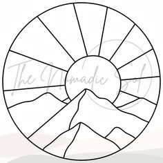 the sun is shining over mountains and hills in this circular stained glass window design,