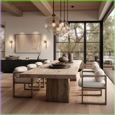 a dining room table with white chairs and lights hanging from it's centerpiece