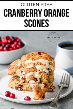 cranberry orange scones with icing on a white plate