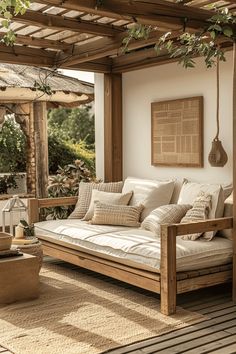 a couch sitting on top of a wooden floor under a pergolated roof next to a window