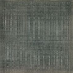 a gray area rug with white dots on the top and bottom, it is very dark