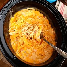 the ultimate crock pot chicken spaghetti is ready to be cooked in the slow cooker