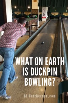 a man leaning over to pick up a bowling ball in a bowling alley with the words, what on earth is duckpin bowling?