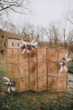 an outdoor area with hay and flowers on it