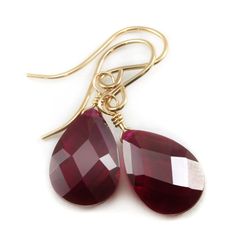 These are teardrops of cubic zirconia in a red ruby faceted cut. The sparkle is amazing! The french earwires are Sterling Silver or 14k Solid Gold or 14k Gold Filled - you choose. The stone size is a large 9x13mm. The earrings hang 1.1 inch. This is high quality AAA CZ. There is 15 carats of CZ. A great wardrobe staple, these go with lots of outfits. The mannequin shows the relative size and how they will hang. Shipping is Free! Diamond Cut Teardrop Earrings Gift, Fine Jewelry Ruby Teardrop, Ruby Teardrop Fine Jewelry, Diamond Cut Pear Teardrop Earrings For Gift, Faceted Teardrop Red Jewelry, Red Teardrop Fine Jewelry, Fine Jewelry In Red Pear Shape, Faceted Drop Teardrop Earrings For Gift, Red Ruby Briolette Jewelry