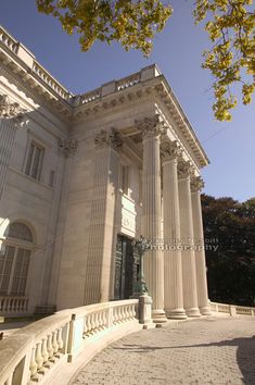 a large white building with columns on the outside