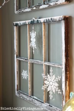 an old window decorated with snowflakes is featured on instagram for the holiday season